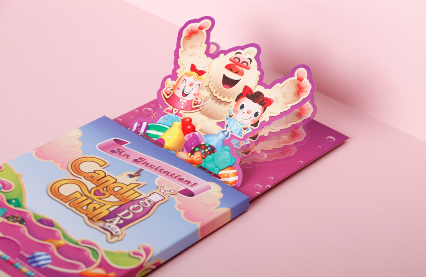 Candy Crush Soda Sage - Product Launch Invitation — When the pack is opened a pop-up illustration springs to life, mimicking the fun of the product itself.