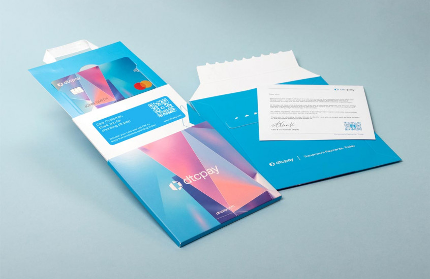 Photo of showing the dtcpay Card packaging, sliding opening, and the accompanying mailer